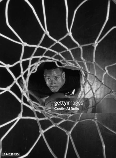 This image has been converted to black and white) Allen Iverson, Shooting Guard and Point Guard for the Philadelphia 76ers looks up through the net...