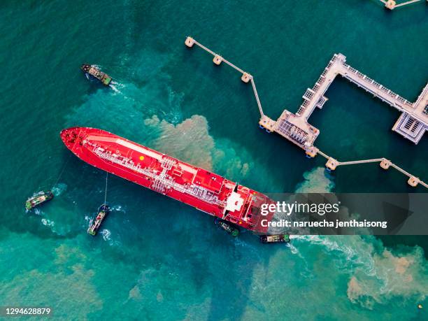 aerial view tanker ship vessel unloading at port, business import export oil and gas petrochemical with tanker ship transportation oil from dock refinery, loading arm oil and gas offshore platforms. - boat singapore bildbanksfoton och bilder