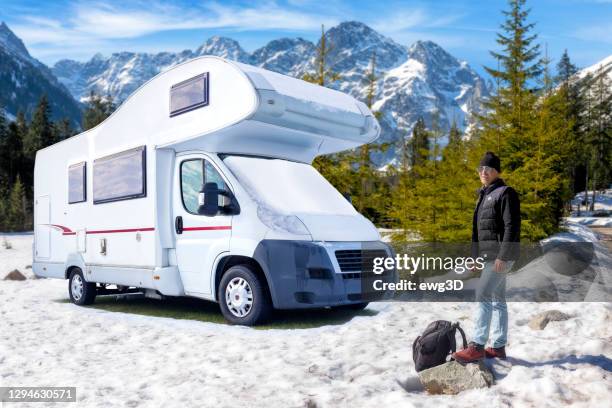 middle aged tourist on a trip to the tatra mountains - motor home winter stock pictures, royalty-free photos & images