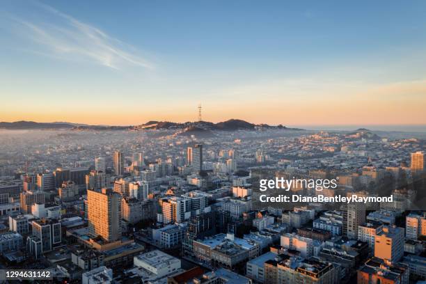 aerial view of fog over san francisco skyline - san francisco stock pictures, royalty-free photos & images