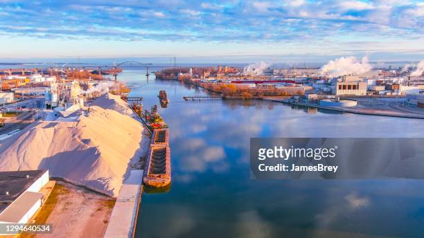 industrial waterfront area on river. - wisconsin stock pictures, royalty-free photos & images