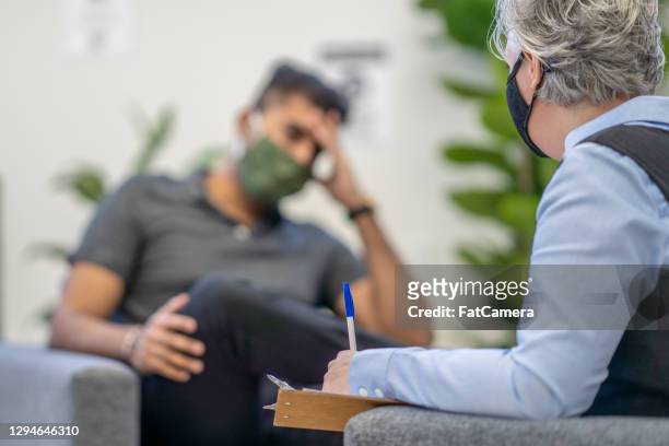 therapy session during pandemic - social worker mask stock pictures, royalty-free photos & images