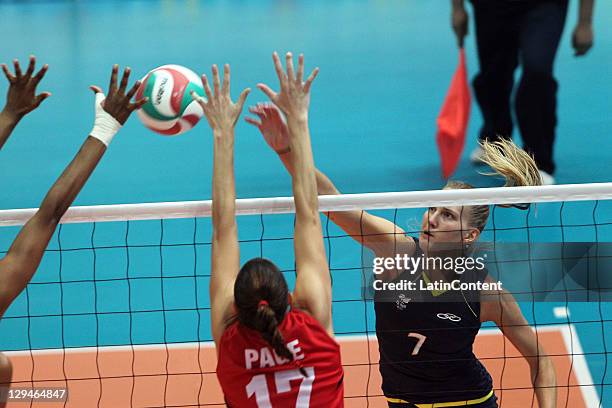 Marianne Steinbrecher from Brazil shot over Canada block in the volleyball women's during the 2011 XVI Pan American Games at Pan American volleyball...