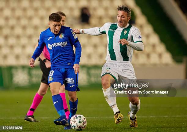 Federico Piovaccari of Cordoba CF and Francisco Portillo of Getafe CF battle for the ball during Copa del Rey Second Round match between Cordoba CF...