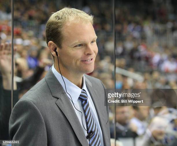 Assistant coach Kevyn Adams of the Buffalo Sabres stands behind the bench during their game against the Los Angeles Kings at the 2011 Compuware NHL...