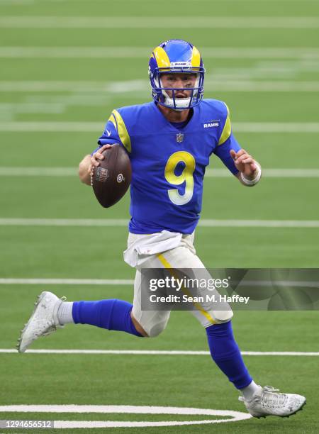 John Wolford of the Los Angeles Rams scrambles from the pocket during the first half of a game against the Arizona Cardinals at SoFi Stadium on...