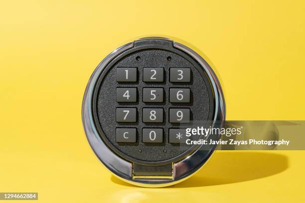 safety lock pad on yellow background - door close button imagens e fotografias de stock