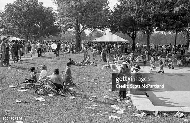 View of people on the lawn, foot paths, and recreational areas in Flushing Meadows Park, in the Corona neighborhood, Queens, New York, New York, June...