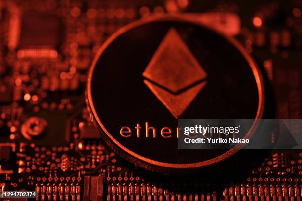 In this photo illustration, a visual representation of digital cryptocurrency Ethereum is arranged on a circuit board of a hard drive on January 3,...