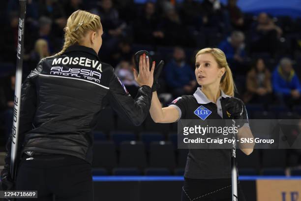 Russia's Victoria Moiseeva congratulates team mate Galina Arsenkina