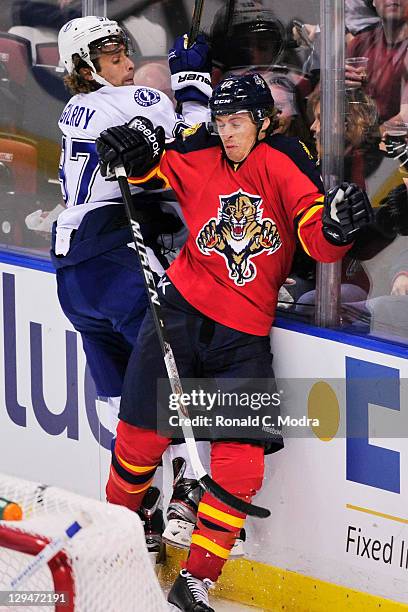 David Booth of the Florida Panthers tangles with Matt Gilroy of the Tampa Bay Lightning during a NHL game at BankAtlantic Center on October 15, 2011.