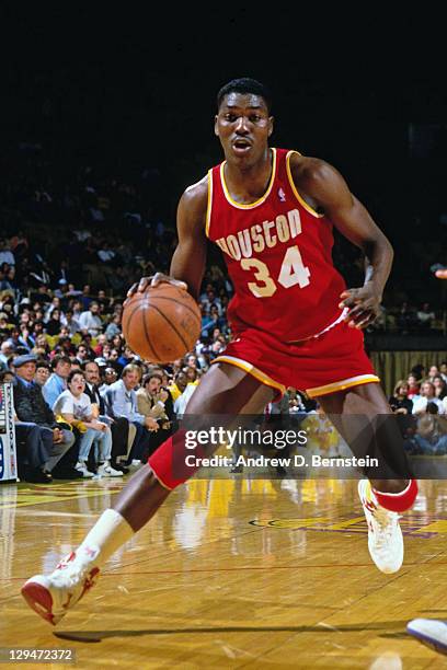 Hakeem Olajuwon of the Houston Rockets dribbles against the Los Angeles Lakers circa 1987 at the Great Western Forum in Inglewood, California. NOTE...