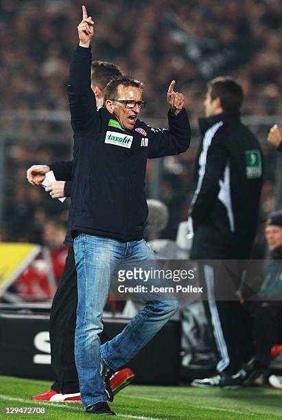 Head coach Norbert Meier of Duesseldorf celebrates after Maximilian Beister of Duesseldorf scored his team's third goal during the Second Bundesliga...