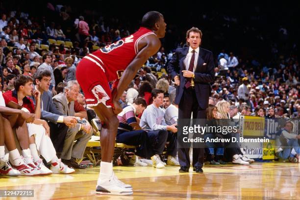 Chicago Bulls head coach Doug Collins stands with Michael Jordan against the Los Angeles Lakers circa 1987 at the Great Western Forum in Inglewood,...