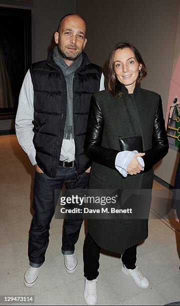 Max Wigram and Phoebe Philo attend a private view of American artist George Condo's first retrospective exhibit 'George Condo: Mental States' at The...