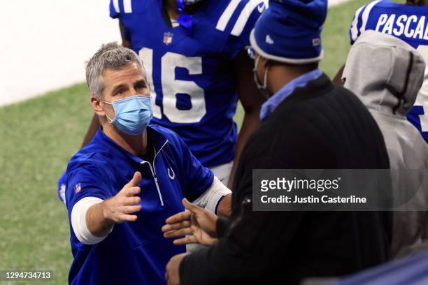 Head coach Frank Reich of the Indianapolis Colts shakes hands with fans after a win over the Jacksonville Jaguars at Lucas Oil Stadium on January 03,...