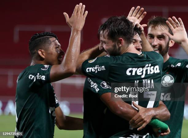 Matias Viña of Palmeiras celebrates with his teammates after scoring the third goal of his team during a first leg semifinal match between River...