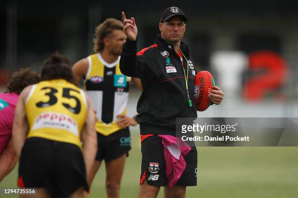 Saints assistant coach Aaron Hamill speaks to players during a St Kilda Saints AFL training session at Moorabbin Oval on January 06, 2021 in...