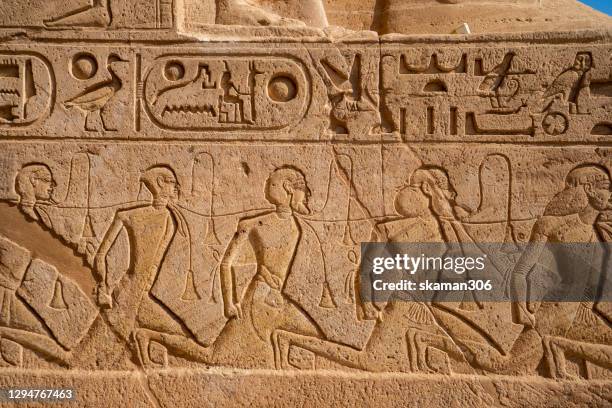 stone carving  pharoah rameses ii the great fighting  hittite empire inside abu simbel temple near aswan egypt - egyptian culture stock pictures, royalty-free photos & images