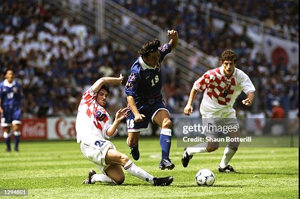 Shoji Jo of Japan goes past Dario Simic of Croatia during the World Cup group H game at the Stade de la Beaujoire in Nantes, France. Croatia won 1-0....
