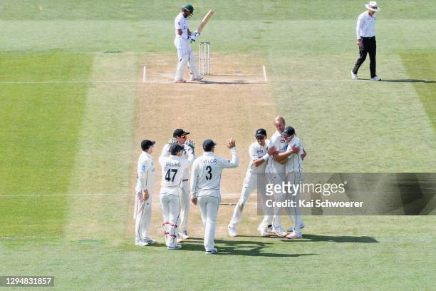 Kyle Jamieson of New Zealand is congratulated by team mates after dismissing Faheem Ashraf of Pakistan during day four of the Second Test match in...