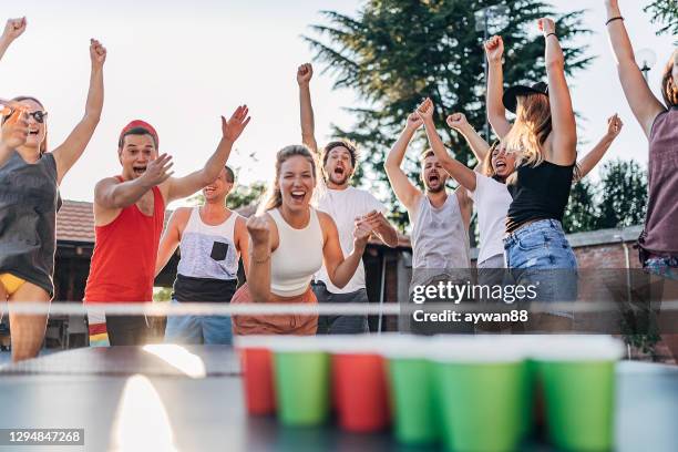 beer pong tournament - friends table tennis stock pictures, royalty-free photos & images