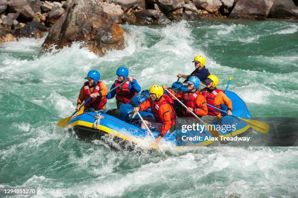 rafting through white water rapids on the karnali river in west nepal - whitewater rafting stock pictures, royalty-free photos & images