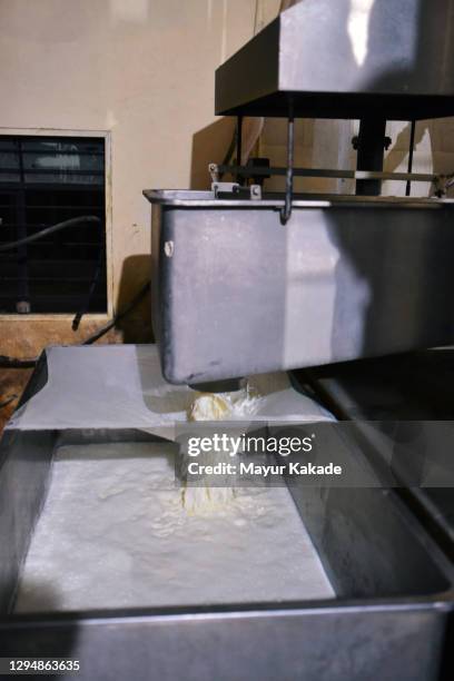 milk being filtered in the dairy factory - filtro de membrana imagens e fotografias de stock