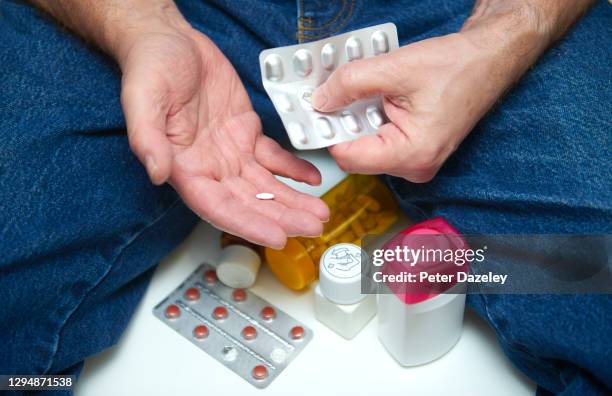 taking medicine, the aging process - codeine stock pictures, royalty-free photos & images