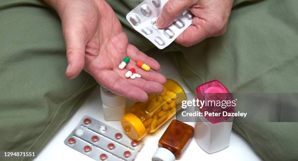 70 year old with blister pack - prescription drugs dangers stock pictures, royalty-free photos & images