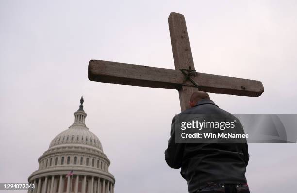 Supporters of U.S. President Donald Trump pray outside the U.S. Capitol January 06, 2021 in Washington, DC. Congress will hold a joint session today...