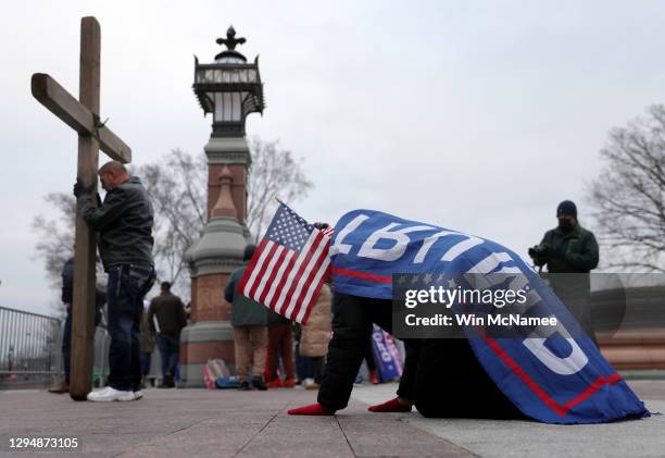 Supporters of U.S. President Donald Trump pray outside the U.S. Capitol January 06, 2021 in Washington, DC. Congress will hold a joint session today...