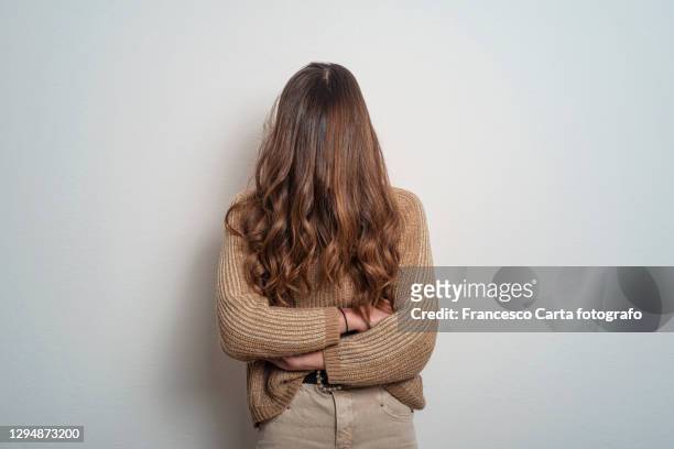 woman with hair over face - no confidence stock pictures, royalty-free photos & images