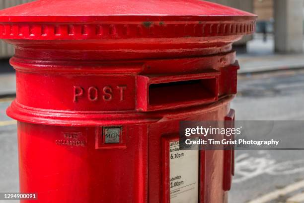 red british post box in an empty london street - mail box stock pictures, royalty-free photos & images