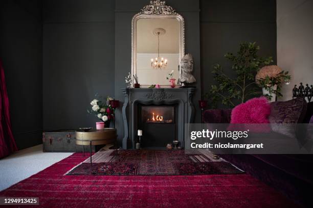 living room with dark walls and authentic fireplace - edwardian room stock pictures, royalty-free photos & images