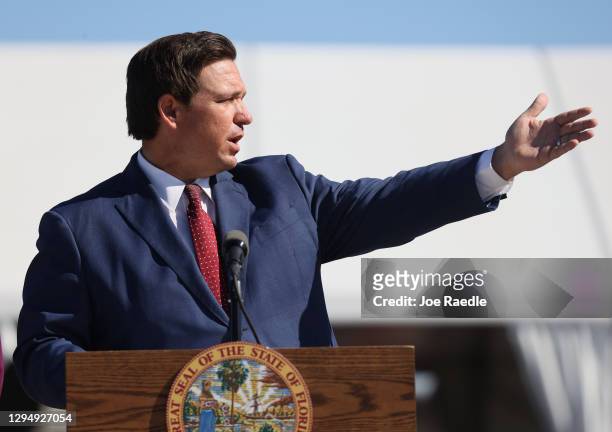 Florida Governor Ron DeSantis speaks during a press conference about the opening of a COVID-19 vaccination site at the Hard Rock Stadium on January...