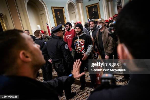 Protesters interact with Capitol Police inside the U.S. Capitol Building on January 06, 2021 in Washington, DC. Congress held a joint session today...