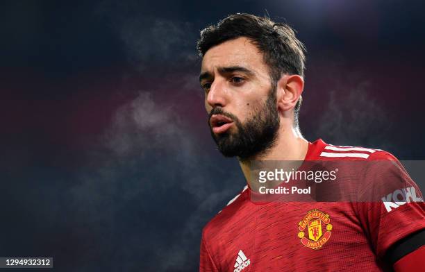 Bruno Fernandes of Manchester United looks on during the Carabao Cup Semi Final match between Manchester United and Manchester City at Old Trafford...