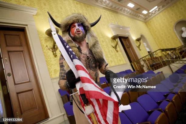 Protester yells inside the Senate Chamber on January 06, 2021 in Washington, DC. Congress held a joint session today to ratify President-elect Joe...