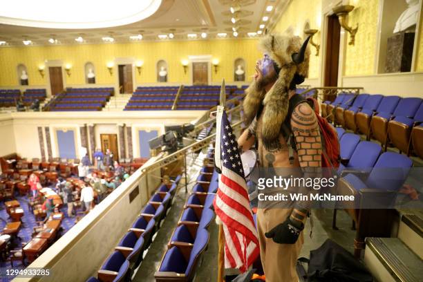 Protester yells inside the Senate Chamber on January 06, 2021 in Washington, DC. Congress held a joint session today to ratify President-elect Joe...