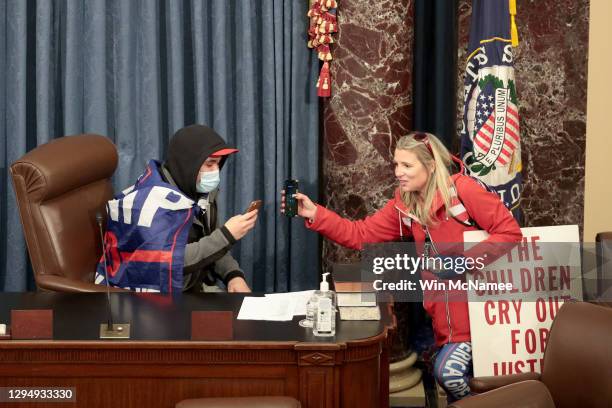 Protester sits in the Senate Chamber on January 06, 2021 in Washington, DC. Congress held a joint session today to ratify President-elect Joe Biden's...