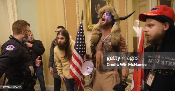 Protesters interact with Capitol Police inside the U.S. Capitol Building on January 06, 2021 in Washington, DC. Congress held a joint session today...