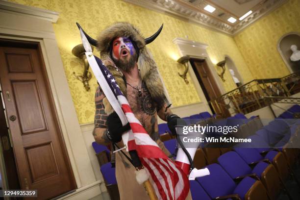 Protester screams "Freedom" inside the Senate chamber after the U.S. Capitol was breached by a mob during a joint session of Congress on January 06,...