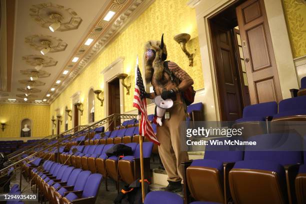 Protester screams "Freedom" inside the Senate chamber after the U.S. Capitol was breached by a mob during a joint session of Congress on January 06,...