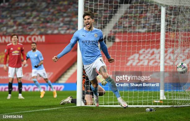 John Stones of Manchester City celebrates after scoring their team's first goal during the Carabao Cup Semi Final match between Manchester United and...