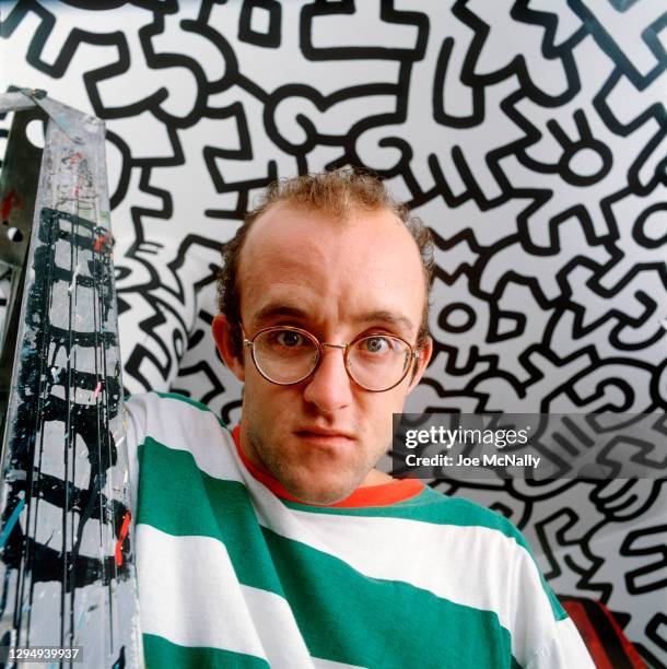 Graffiti artist Keith Haring, known for his squiggly doodles of dogs and humans poses for a portrait in September 1986 in New York City, New York.