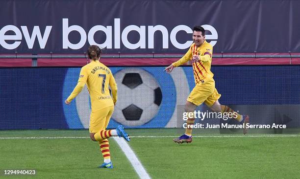 Lionel Messi of Barcelona celebrates with Antoine Griezmann of Barcelona after scoring his sides third goal during the La Liga Santander match...