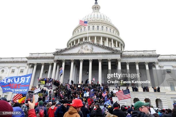 Protesters gather on the U.S. Capitol Building on January 06, 2021 in Washington, DC. Pro-Trump protesters entered the U.S. Capitol building after...