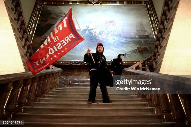 Protesters supporting U.S. President Donald Trump storm the U.S. Capitol on January 06, 2021 in Washington, DC. Congress held a joint session today...