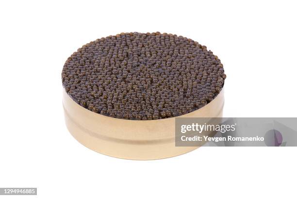 black sturgeon caviar in a tin can, isolated on white background - kaviaar stockfoto's en -beelden